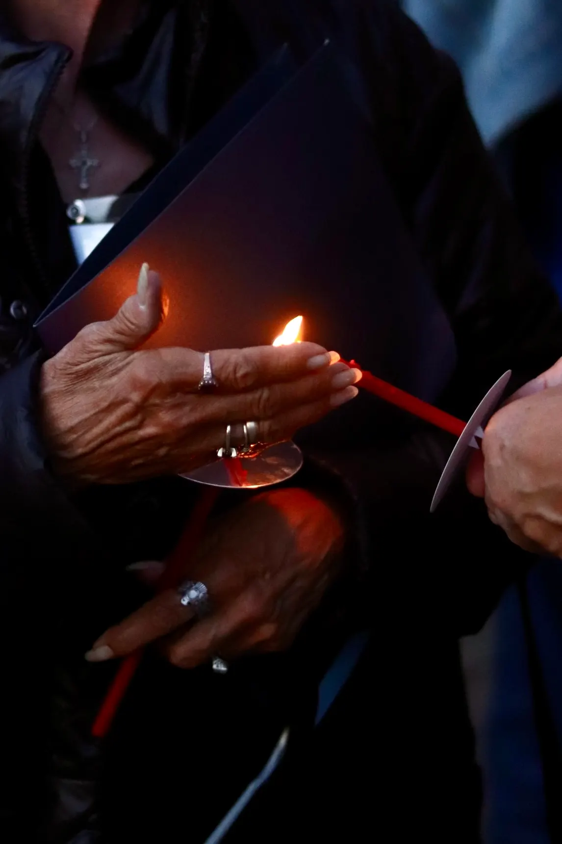 Congregation holding lit red candles at Shiloh Baptist Church in Washington, DC